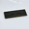 Fabricante de Logos de Letras Metálicas Ropa Personalizada Letrero Cosido a Mano Sombrero Traje de Baño Jeans Accesorios de Ropa Placa de Nombre