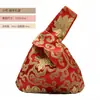Venta al por mayor del fabricante Empaques de regalo grandes y pequeños Bolsas de regalo de almacenamiento Bolsas de mano con asa única estilo chino para recuerdos