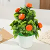Planta artificial em vaso com flor de ameixeira de cinco folhas para decoração de mesa de jantar em ambientes internos. Ideal para decoração de interiores.