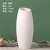 Una generación de jarrón de cerámica para quemar pigmento blanco al por mayor para plantar agua, adornos de flores secas, puesto de suministro, outlet de fábrica
