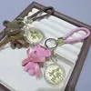 Popular Llavero Colgante Pastel de la Fortuna Princesa Dorada Colgante de Lista Dorada Bolso Regalo de Paz y Alegría