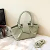 Bolso de mano transfronterizo para mujer 2026 nuevo de alta gama simple versátil plisado de hombro cruzado bolso cubo para ir al trabajo