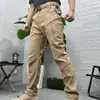 Pantalones tácticos para hombre de exportación transfronteriza del sudeste asiático para exteriores, con múltiples bolsillos, resistencia al desgaste, propiedades de secado rápido y adecuados para entrenamiento, montañismo, senderismo y trabajo.