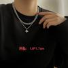 Collar de cruz apilada de doble capa de hip-hop transfronterizo europeo y americano para hombre, diseño de nicho moderno, cadena cubana con sentido de acero de titanio a juego.