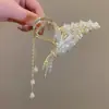 Pinza para el pelo con borla de mariposa de lirio del valle Parte trasera de la cabeza Pinza de garra exquisita Mujeres Verano Talla grande Pinza de tiburón de alta gama Adorno para la cabeza