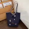 Bolso de Hombro de Gran Capacidad para el Trabajo y los Viajes Diarios para Mujer 2026 Nuevo Bolso de Tela de Nylon de Comercio Exterior con Bordado de Cachorro de Dibujos Animados Bolso de Doble Cara