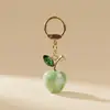 2026 Transfronterizo Nuevo Producto Creativo Llavero de Manzana con Purpurina Exquisito Moda Cristal Pequeño Colgante de Bolsa de Regalo Al por Mayor