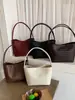 Bolsa de cubo nueva de verano transfronteriza versión coreana nicho bajo el brazo moda casual bolso de mano bolso de hombro de gran capacidad