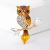 Broche de búho de doble cabeza de moda creativa transfronterizo para mujer, pin de alta gama, corsage exagerado de personalidad de temperamento elegante