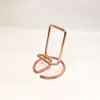 Soporte Metálico Simple para Teléfono al por Mayor de Fábrica, Soporte de Hierro para Escritorio de Teléfono y Tableta, Soporte para Teléfono Gadget para Maratones