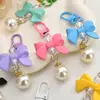 Colgante Macaron de Lazo de Moda Llavero para Teléfono de Corbata de Moño Accesorio para Bolsa de Auriculares Equipaje Ropa Regalo para Estudiante