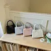 2026 Estilo francés fresco y elegante lazo verano nuevo gran capacidad color sólido moda hombro bandolera bolso para mujer