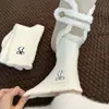 Calcetines de felpa para mujer, estilo coreano, de media pantorrilla, cálidos de invierno, forrados de forro polar, gruesos, blancos, con lazo, calcetines holgados de moda de media pantorrilla