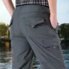 Pantalones de hombre transfronterizos nuevos de otoño pantalones casuales para hombre pantalones deportivos transpirables de secado rápido ajustados para exteriores mono para hombre