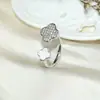 Anillo de Trébol de Cuatro Hojas de Lujo Ligero Transfronterizo Europeo y Americano Chapado en Cobre Dorado Circonita Microincrustada Moda Exquisita Anillo Abierto de Gama Alta para Mujeres