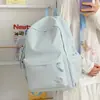 Mochila Bordada Estilo Coreano para Estudantes Nova Simples com Design de Letras Alta Qualidade Versátil Grande Capacidade Bolsa Escolar para Estudantes Universitários