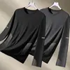 Camiseta casual versátil de manga larga para hombre para otoño, cuello redondo, color liso moderno, cómoda, transpirable y de corte holgado.