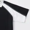 Camisa tipo polo deportiva retro de retazos en blanco y negro con mangas raglán acanaladas, corte holgado, cuello camisero, top casual para estudiantes hombres y mujeres