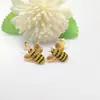 Qingdao meiouya joyería al por mayor suministro de primera mano pendientes de botón de abeja de diamante amarillo europeo y americano traje de collar