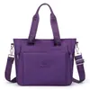 Bolsa de ombro de tecido Oxford de nylon de grande capacidade, versátil para o trajeto diário, leve e adequada para o uso diário; pode ser carregada na mão ou usada como bolsa transversal; ideal para o trabalho ou como uma bolsa de compras