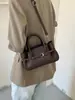 Bolso de mano con patrón de lichi, bolso cruzado simple y elegante, nuevo modelo otoño 2026, diseño retro de nicho, bolso de hombro para el día a día