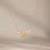 Europa Cruzada Comercio Electrónico Estilo INS Temperamento Acero de Titanio Incrustaciones de Pedrería Lujo Ligero Acero Inoxidable Chapado en Oro 18k Collar de Mariposa para Mujeres Venta al por Mayor