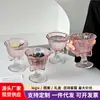 Taza alta con lazo rosa, copa de vino tinto de alto valor, copa de champán, copa de cóctel, taza de café