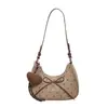 Bolso de mano fresco y sencillo de lunares estilo coreano para mujer, nueva moda de verano 2026, elegante lazo, bolso de hombro versátil