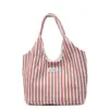 Bolsa de lona bolsa tote de gran capacidad para mujer 2026 nuevo estilo coreano nicho rayada simple moda bolso de mano bolso de hombro