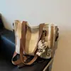 Bolsa Feminina de Comércio Exterior 2025 Nova Moda Bolsa de Lona Listrada Grande Capacidade Bolsa de Ombro Portátil para o Dia a Dia Bolsa Tote Transversal