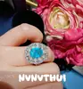 Beleza Efêmera: Anel de Topázio Azul Marinho com Laço de Diamantes, Joia Haute Couture, Anel de Flor de Ovo de Pombo com Diamantes Brilhantes