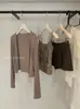 Conjunto de cárdigan simple Y.JIA Yijia para protección solar de principios de otoño + Chaleco con diseño de espalda descubierta + Falda de línea A para mujer 5021