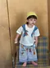 Estilo Ins primavera e verão novo infantil fofo animal desenho animado conjunto azul camiseta branca calça listrada xadrez azul