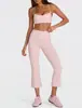 Conjunto de dos piezas para mujer estilo europeo y americano, con tirantes finos y pantalones acampanados cropped de cintura alta, sensación nude, fitness casual para correr, venta al por mayor