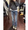 Jeans acampanados de tiro bajo de alta calle americanos para mujer, nuevo estilo de verano, diseño moderno, nicho, corte ajustado, versátiles, elásticos