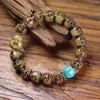 Budismo Tibetano hueso de retorno cubo cuentas incrustadas talladas A-Dai tres agujeros pulsera bucle único retro material de juego cultural accesorios de vidrio pulsera