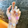 Cadena de llavero de cuentas de colores con luz UV creativa para teléfono móvil, colgante lindo para bolso, accesorios para funda de teléfono móvil, venta al por mayor