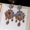 Pendientes de botón con colgante de flor de diamante incrustado de aguja plateada en forma de gota de agua, pendientes de lujo ligero de alta gama, pendientes versátiles de industria pesada europea y americana para mujer