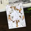Tarjetas de felicitación estilo sobre de boda cortadas con láser con diseño floral transfronterizo europeo con páginas interiores de papel kraft para invitaciones de boda al por mayor