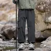Nuevos pantalones de exterior impermeables, resistentes a las arrugas y repelentes al agua para otoño, para parejas de camping y senderismo, diseño moderno de ropa de trabajo para hombre