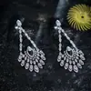 Pendientes de botón con colgante de gota de agua hueca de circón de aguja plateada, pendientes de lujo ligero de alta gama, temperamento, exquisitos, versátiles, nicho para mujer