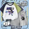 Conjunto de Dos Piezas para Niños: Camiseta de Manga Raglán Color Cáscara de Huevo de Verano Estilo Obrero de Barcaza con Cuello Redondo y Corte Holgado, Combinada con Shorts