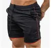 Amazon shorts de verão masculinos de secagem rápida cor sólida esportivos fitness calças de cinco pontos calças de praia fabricantes atacado
