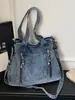 Bolsa de mezclilla tipo tote para mujer, modelo nuevo 2026, gran capacidad, versátil para ir al trabajo, bolsa cruzada, bolso grande para que los estudiantes lo usen en clase