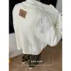 Nuevos suéteres de punto para otoño e invierno para hombres y parejas, chaquetas cárdigan con agujeros, estilo callejero europeo y americano de moda, venta al por mayor de fábrica transfronteriza