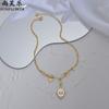 Exclusivo transfronterizo para collar con colgante de estrella de marca ovalada de acero inoxidable 14k retro francés para comercio exterior, joyería caliente al por mayor