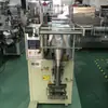 Máquina envasadora de remolques, máquina envasadora de cubos con cadena para nueces de Guangzhou, máquina envasadora vertical con volcado automático y máquina selladora