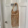 Bolso tejido para mujer, nuevo modelo de verano 2026, nicho y súper popular, bolso de hombro para el trabajo, bolso cruzado con borlas, bolso de playa de paja