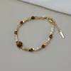 Colar de olho de tigre Maillard outono e inverno, corrente de clavícula Fritillaria da moda, elegante pulseira de caracol ferradura de olho de diabo de celebridade cibernética