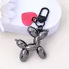 Estilo Ins Perro Globo Color Caramelo Colgante Llavero Metal Amor Estuche para Auriculares Colgante de Bolso Accesorios para Pareja